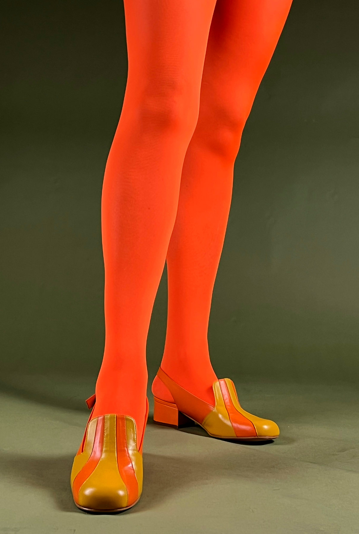 https://www.modshoes.co.uk/wp-content/uploads/2022/09/modshoes-ladies-vintage-tights-80-Denier-Opaque-Velvet-Tights-in-Florencent-Orange-02.jpg